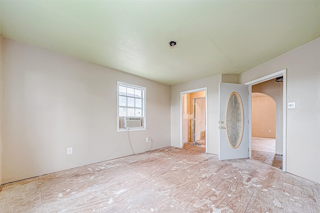 unfurnished bedroom featuring cooling unit