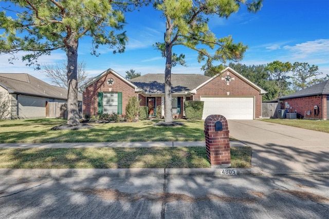 ranch-style home with a garage and a front lawn