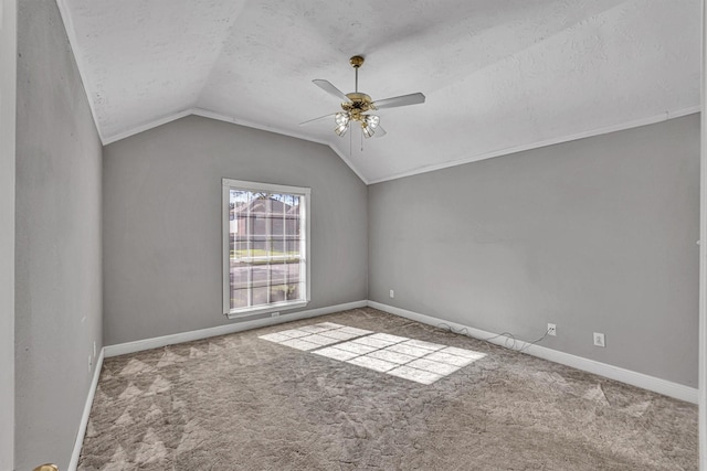 bonus room featuring ceiling fan, lofted ceiling, carpet flooring, and a textured ceiling