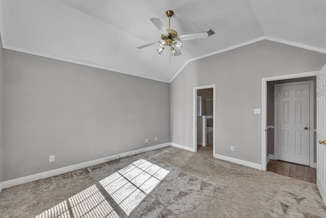 interior space featuring vaulted ceiling, ceiling fan, and carpet