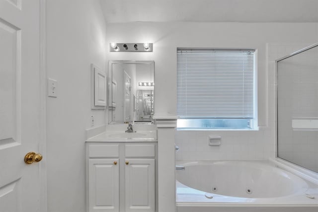 bathroom featuring vanity and plus walk in shower