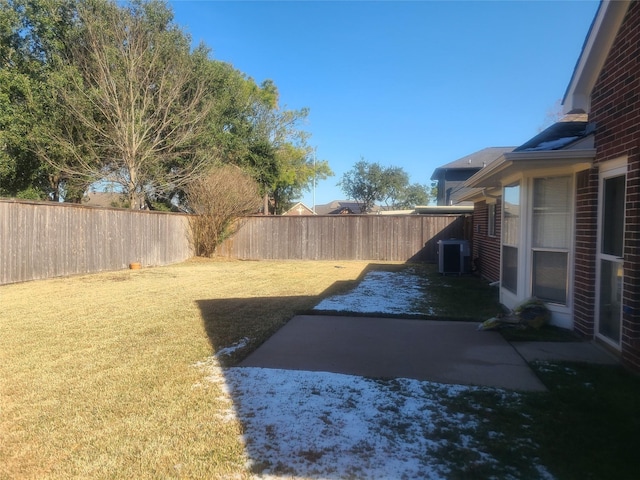 view of yard featuring a patio and central AC