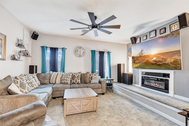 living room with ceiling fan and light colored carpet