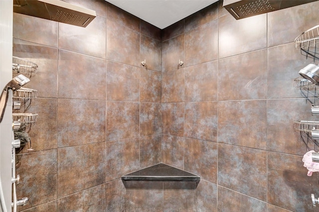 interior details featuring a tile shower