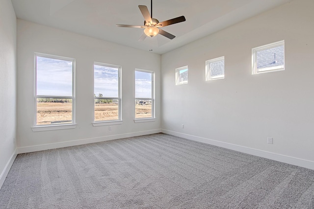 spare room with ceiling fan and carpet flooring