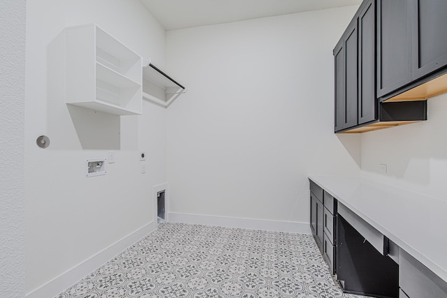 washroom with cabinets, hookup for a washing machine, and hookup for an electric dryer