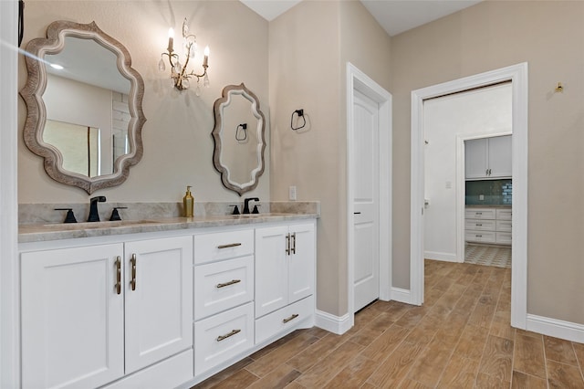 bathroom featuring tasteful backsplash and vanity