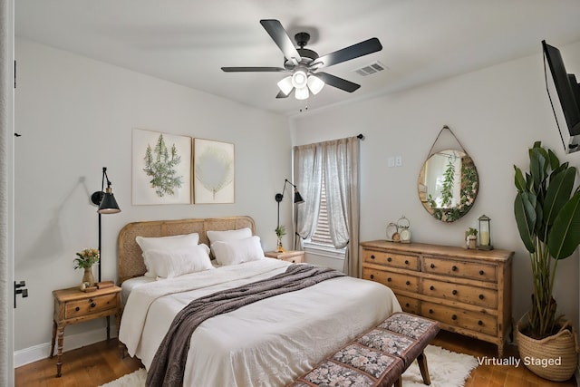 bedroom with ceiling fan and wood-type flooring