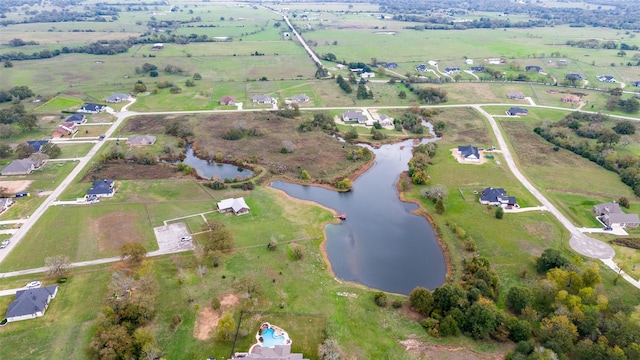 aerial view with a water view and a rural view