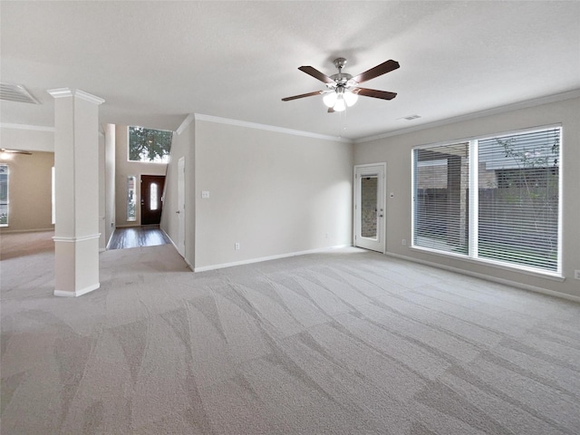 unfurnished room featuring ornate columns, ornamental molding, light carpet, and ceiling fan