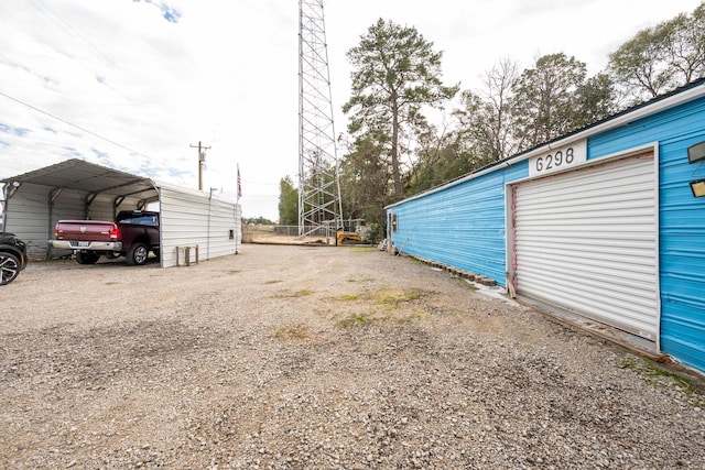 exterior space featuring a carport