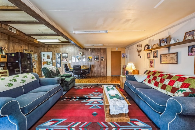 living room with wood walls