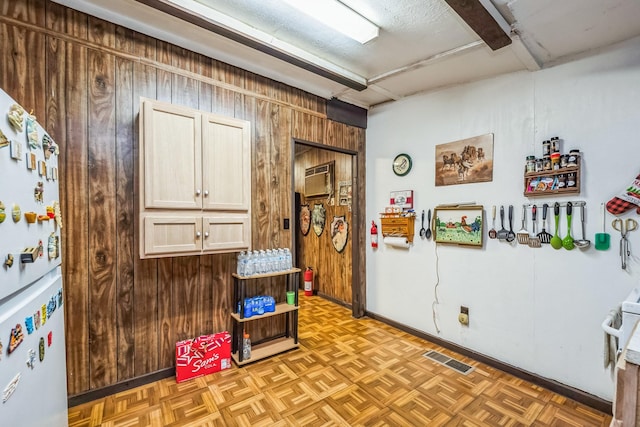 misc room featuring light parquet flooring and wooden walls