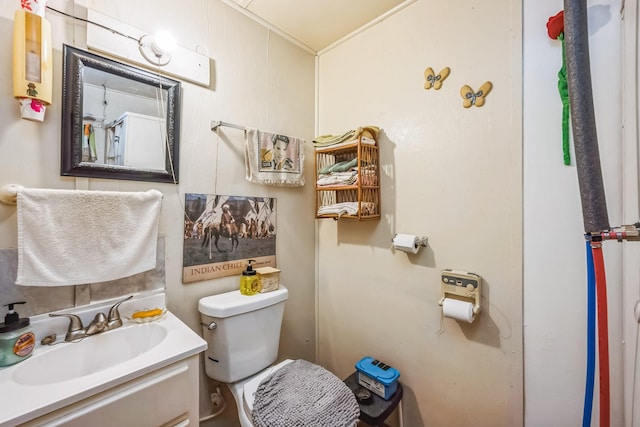 bathroom with toilet and vanity