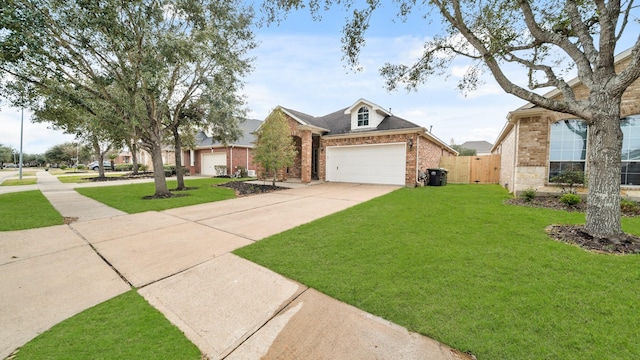 view of front of property with a front lawn and a garage