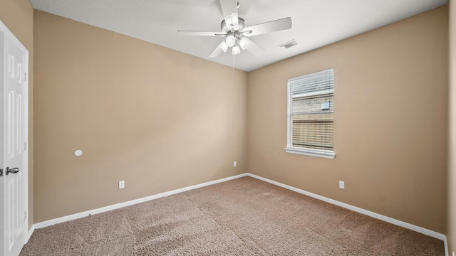 carpeted empty room with ceiling fan