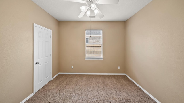 unfurnished room featuring carpet and ceiling fan