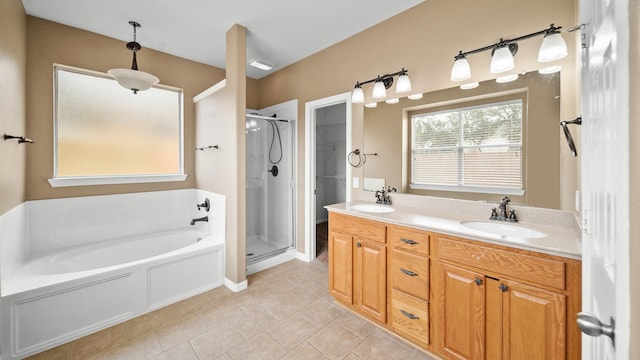 bathroom with vanity, tile patterned floors, and shower with separate bathtub