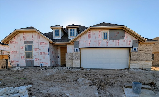 property in mid-construction with a garage