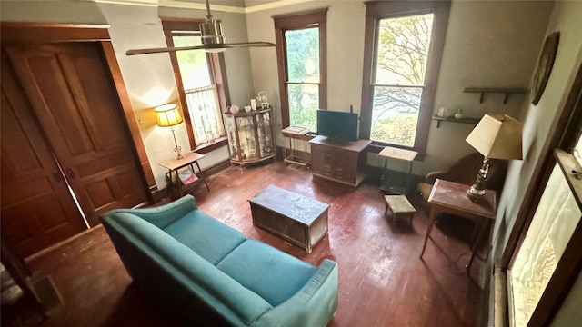 sitting room with dark wood-type flooring