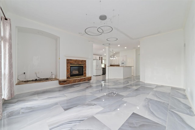 unfurnished living room with crown molding