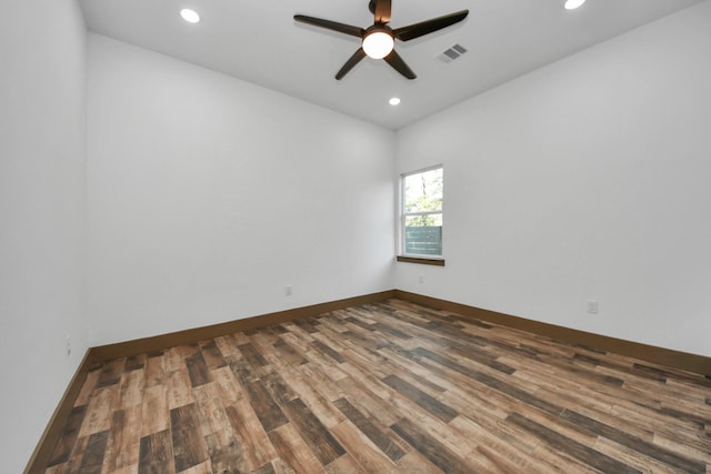 empty room featuring dark hardwood / wood-style floors and ceiling fan