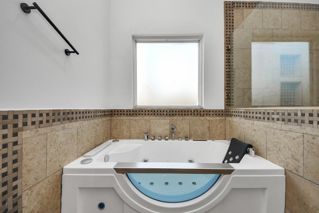 bathroom featuring a tub to relax in