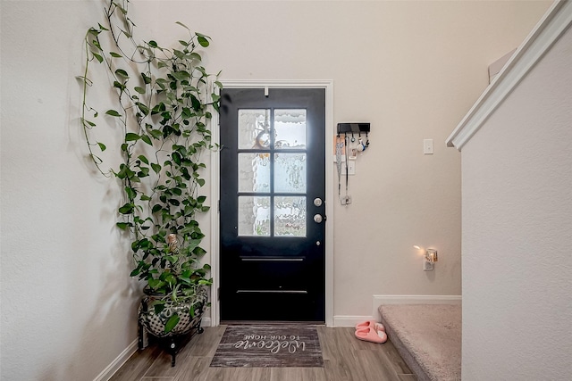 doorway to outside with hardwood / wood-style flooring