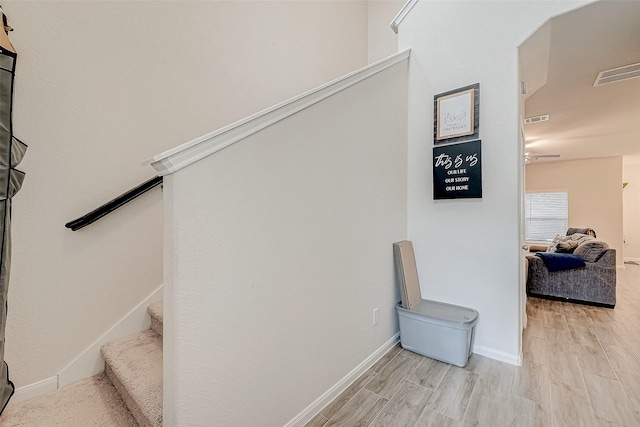 stairway featuring hardwood / wood-style flooring