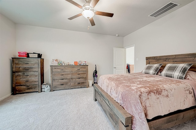 bedroom with ceiling fan and light carpet