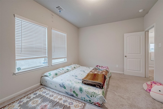 bedroom with light carpet