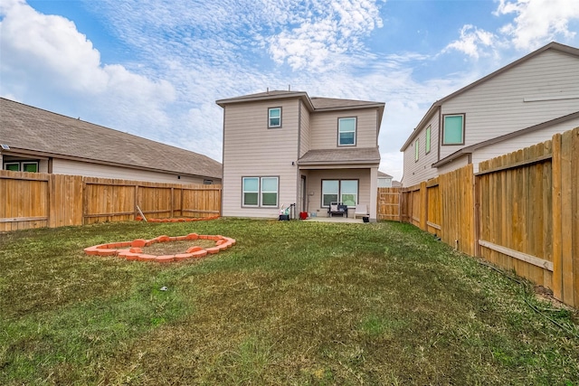 back of property featuring a patio area and a yard