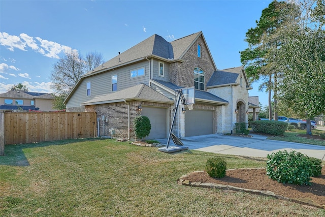 view of front of house featuring a shingled roof, a front lawn, fence, a garage, and driveway