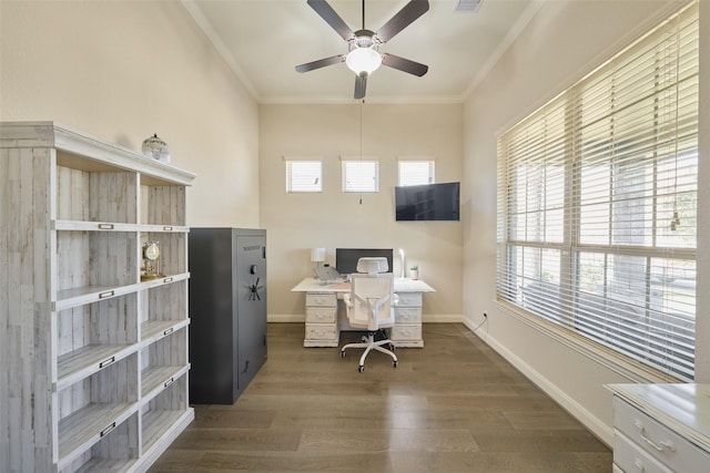 home office with ceiling fan, dark wood-type flooring, and crown molding