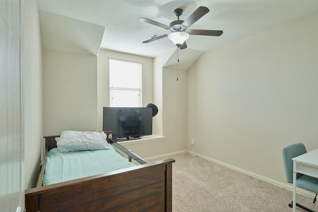 bedroom with ceiling fan, light carpet, and lofted ceiling