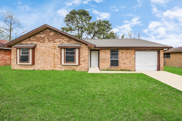 ranch-style home featuring a front yard and a garage