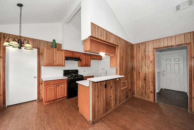 kitchen featuring vaulted ceiling, a notable chandelier, kitchen peninsula, hanging light fixtures, and black gas range oven