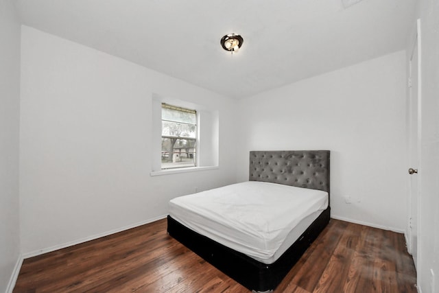 bedroom featuring dark hardwood / wood-style flooring