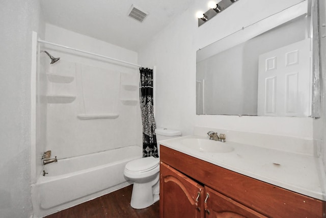 full bathroom featuring hardwood / wood-style flooring, toilet, vanity, and shower / bathtub combination with curtain