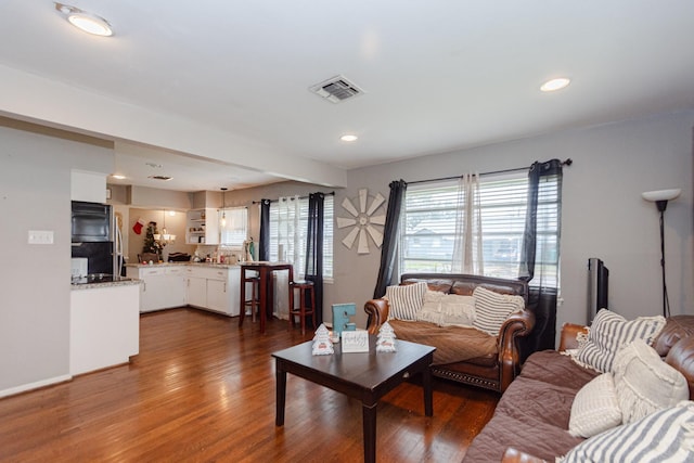 living room with dark hardwood / wood-style floors