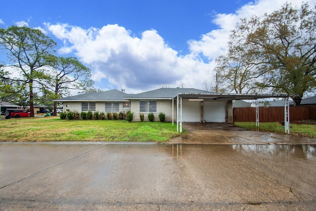 ranch-style house with a garage and a front lawn