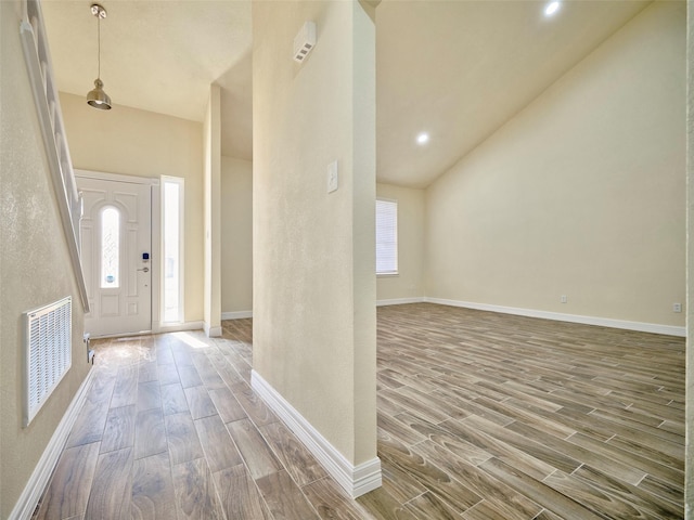 entryway with high vaulted ceiling