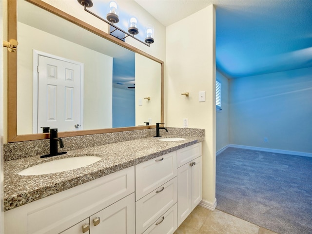 bathroom featuring tile patterned flooring and vanity