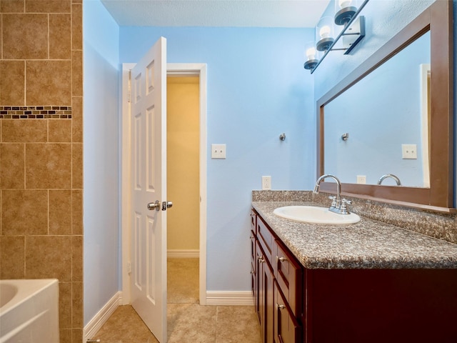 bathroom with tile patterned floors and vanity