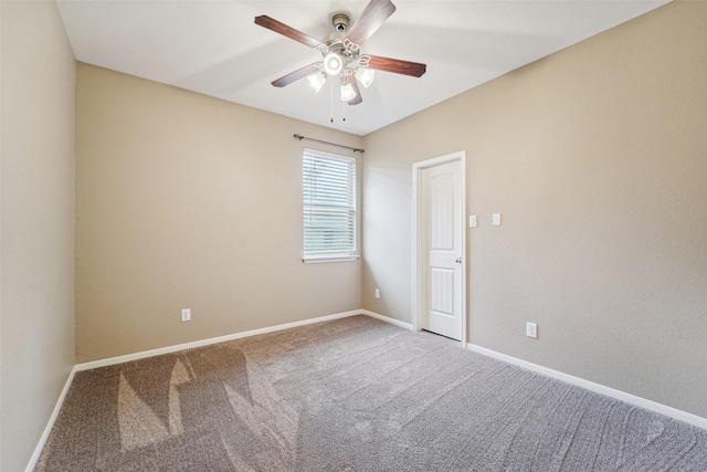 unfurnished room featuring ceiling fan and carpet flooring