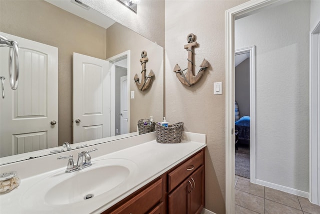 bathroom with vanity and tile patterned flooring