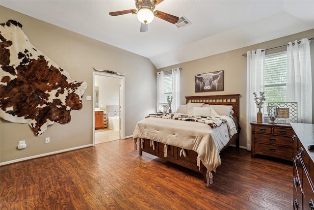 bedroom with ceiling fan, ensuite bathroom, lofted ceiling, and dark hardwood / wood-style floors