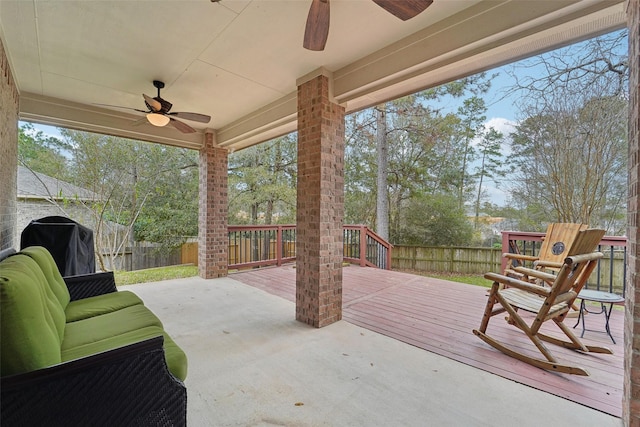 view of patio / terrace featuring ceiling fan, a wooden deck, and area for grilling