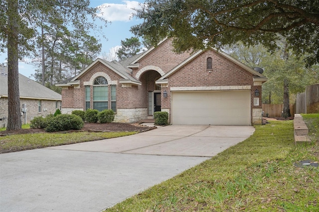 view of front of property with a front lawn and a garage