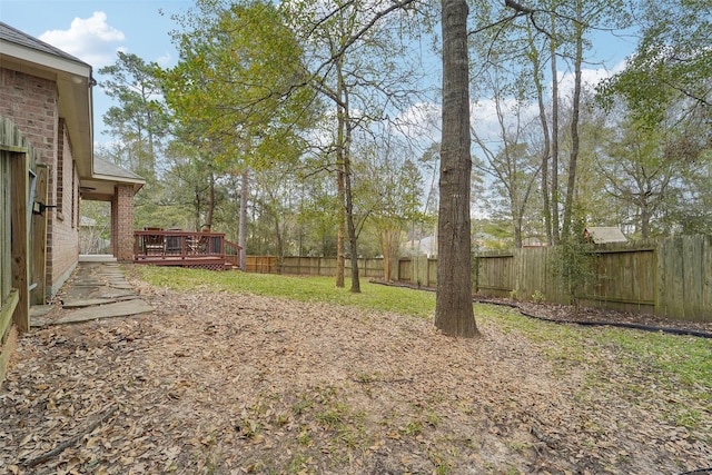 view of yard featuring a deck